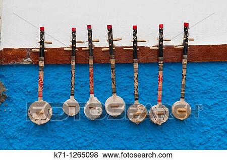 Stringed musical instruments displayed in the Oudayas Casbah in Rabat, Morocco View Large Photo Image Stock Photo - Stringed musical instruments displayed in the Oudayas Casbah in Rabat, Morocco. Fotosearch