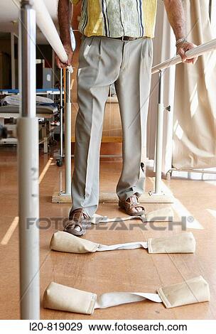 Stock Photo - Stroke rehabilitation, parallel bars for coordination exercises. Hospital Universitario de Gran Canaria Doctor Negrin, Las Palmas de Gran Canaria. Canary Islands, Spain. Fotosearch