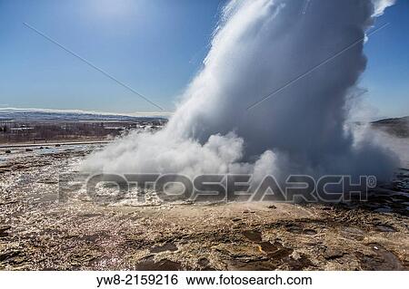 Stock Photograph - Strokkur geyser erupting, Iceland.. Fotosearch