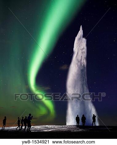 Stock Image - Strokkur Geyser erupting with Northern Lights Digital composite, Iceland. Fotosearch