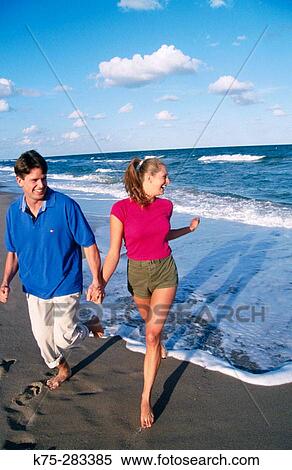 strolling along the beach View Large Photo Image Stock Photography - strolling along the beach. Fotosearch