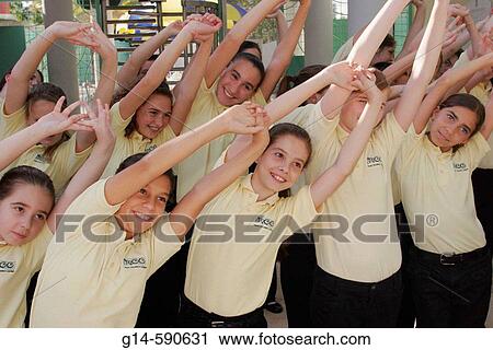 Student, group, sing, stretch before performance. Miami Children's Chorus. Flamingo Park. Miami Beach. Florida. USA. View Large Photo Image Stock Image - Student, group, sing, stretch before performance. Miami Children's Chorus. Flamingo Park. Miami Beach. Florida. USA.. Fotosearch