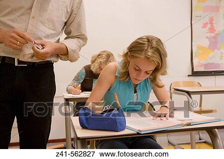 Stock Photo - Student in a classroom.. Fotosearch