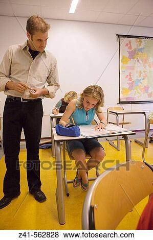 Stock Photo - Student in a classroom.. Fotosearch