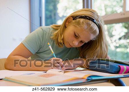 Student in a classroom. View Large Photo Image Stock Photo - Student in a classroom.. Fotosearch