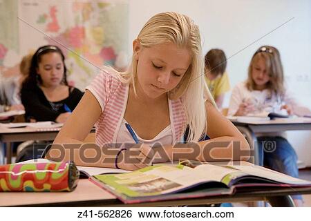 Student in a classroom. View Large Photo Image Stock Photograph - Student in a classroom.. Fotosearch