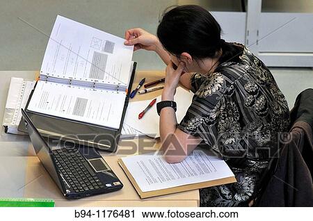 Stock Image - Student in the library of the Barcelona University. Montalegre street. Ciutat vella district. Barcelona. Catalonia. Spain.. Fotosearch