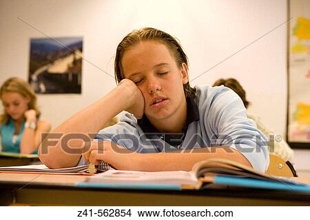 Picture - Student sleeping in the classroom. Fotosearch