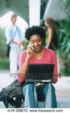 student with laptop and cellular View Large Photo Image Stock Image - student with laptop and cellular. Fotosearch