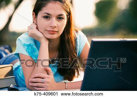 Student with laptop outdoors View Large Photo Image Stock Image - Student with laptop outdoors. Fotosearch