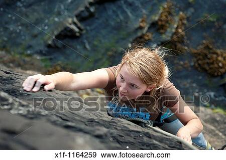 Students at Aberystwyth University practicing climbing on the sea wall, Wales UK View Large Photo Image Stock Photo - Students at Aberystwyth University practicing climbing on the sea wall, Wales UK. Fotosearch