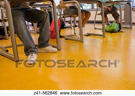 Stock Photograph - Students feet in a classroom.. Fotosearch