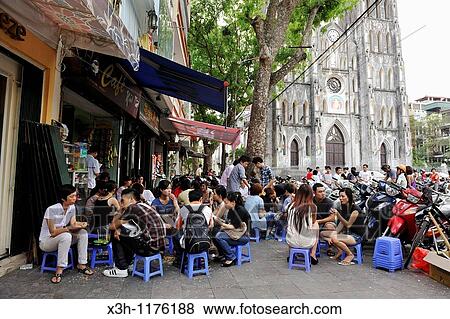 students outside cafe, St Joseph Cathedral square, Hanoi, Northern Vietnam, southeast asia View Large Photo Image Stock Photo - students outside cafe, St Joseph Cathedral square, Hanoi, Northern Vietnam, southeast asia. Fotosearch