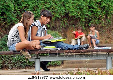 Stock Photo - Students taking a lesson outside Roman ruins. Fotosearch