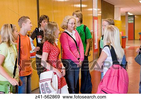 Students talking in the hallway. View Large Photo Image Stock Photo - Students talking in the hallway.. Fotosearch