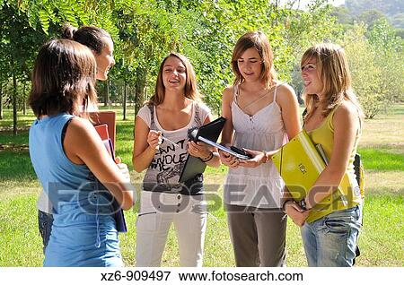 Stock Photo - students talking on campus. Fotosearch