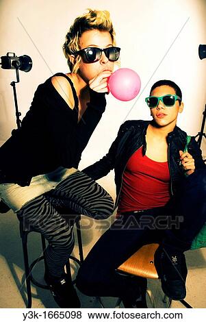 Studio picture of two girls playing with balloons. View Large Photo Image Stock Photo - Studio picture of two girls playing with balloons.. Fotosearch