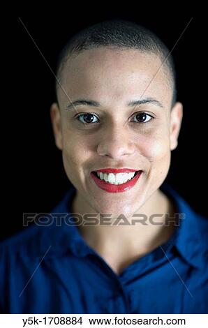Studio-portrait of a young, African woman with a large smile. View Large Photo Image Picture - Studio-portrait of a young, African woman with a large smile.. Fotosearch