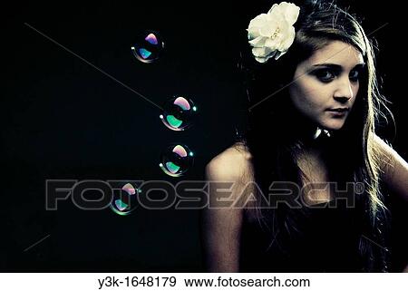 Studio portrait of a young girl with soap bubbles. View Large Photo Image Stock Photo - Studio portrait of a young girl with soap bubbles.. Fotosearch