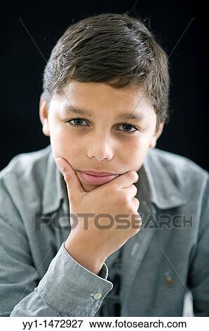 Studio-portrait of a young, dark-skinned teenager. View Large Photo Image Stock Photo - Studio-portrait of a young, dark-skinned teenager.. Fotosearch