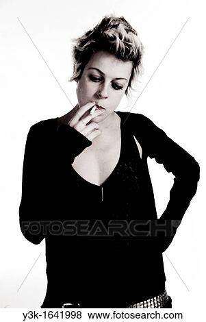 Studio portrait of an alternative young girl smoking. View Large Photo Image Stock Photo - Studio portrait of an alternative young girl smoking.. Fotosearch