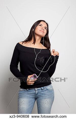 Studio portrait of young woman View Large Photo Image Stock Photo - Studio portrait of young woman. Fotosearch
