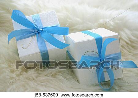 Studio shot gift boxes on sheep skin. View Large Photo Image Stock Photo - Studio shot gift boxes on sheep skin.. Fotosearch