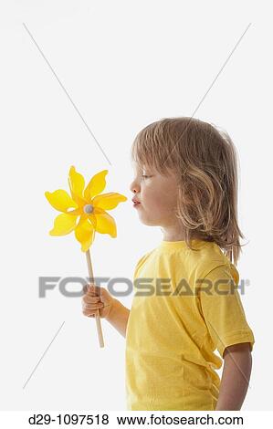 studio shot of a boy playing with pinwheel - isolated on white View Large Photo Image Stock Photo - studio shot of a boy playing with pinwheel - isolated on white. Fotosearch