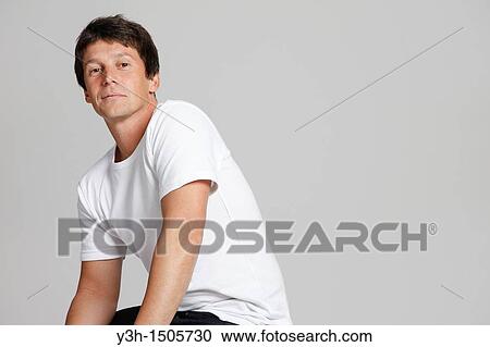 Studio shot of Argentinian man, looking at camera View Large Photo Image Stock Image - Studio shot of Argentinian man, looking at camera. Fotosearch