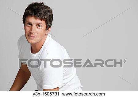Stock Image - Studio shot of Argentinian man, looking at camera. Fotosearch