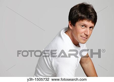 Stock Image - Studio shot of Argentinian man, looking at camera. Fotosearch