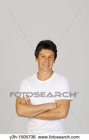 Studio shot of Argentinian man, looking at camera View Large Photo Image Stock Photograph - Studio shot of Argentinian man, looking at camera. Fotosearch