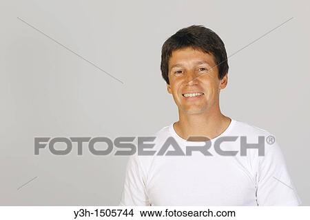 Studio shot of Argentinian man, smiling View Large Photo Image Picture - Studio shot of Argentinian man, smiling. Fotosearch