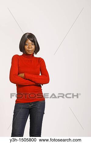 Studio shot of black woman, arms crossed View Large Photo Image Stock Image - Studio shot of black woman, arms crossed. Fotosearch