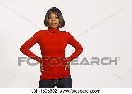 Studio shot of black woman, looking at camera View Large Photo Image Stock Image - Studio shot of black woman, looking at camera. Fotosearch