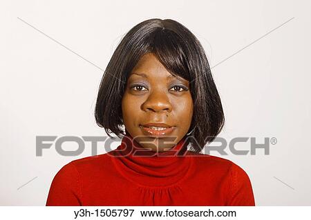 Studio shot of black woman, looking at camera View Large Photo Image Stock Photo - Studio shot of black woman, looking at camera. Fotosearch