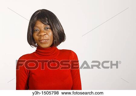 Stock Photo - Studio shot of black woman, looking at camera. Fotosearch