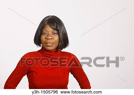 Studio shot of black woman, looking at camera View Large Photo Image Stock Photograph - Studio shot of black woman, looking at camera. Fotosearch