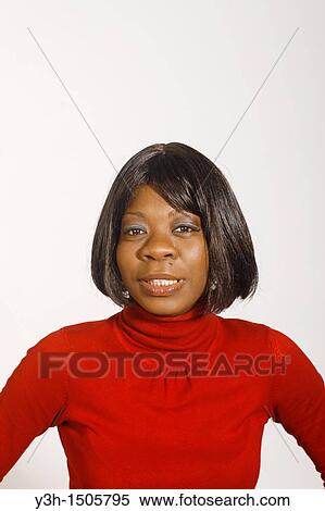 Studio shot of black woman, looking at camera View Large Photo Image Stock Photography - Studio shot of black woman, looking at camera. Fotosearch
