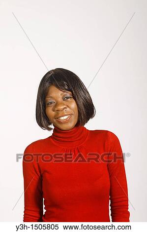 Stock Photography - Studio shot of black woman, looking at camera. Fotosearch