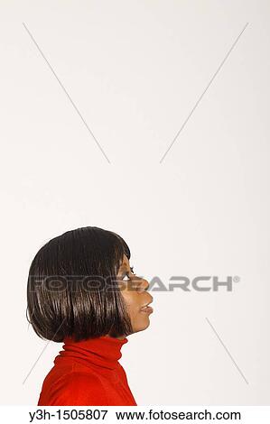 Studio shot of black woman, profile View Large Photo Image Stock Photo - Studio shot of black woman, profile. Fotosearch