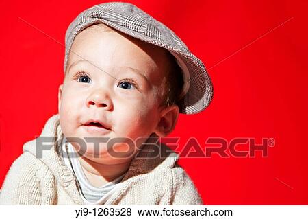 Studio shot of Caucasian baby wearing hat View Large Photo Image Stock Photo - Studio shot of Caucasian baby wearing hat. Fotosearch
