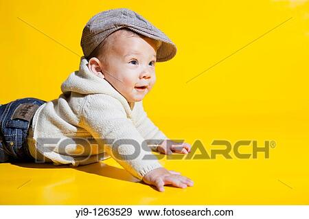 Studio shot of Caucasian baby wearing hat View Large Photo Image Stock Photo - Studio shot of Caucasian baby wearing hat. Fotosearch