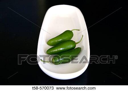 Studio shot of chilli peppers on white tray, black background View Large Photo Image Stock Image - Studio shot of chilli peppers on white tray, black background. Fotosearch