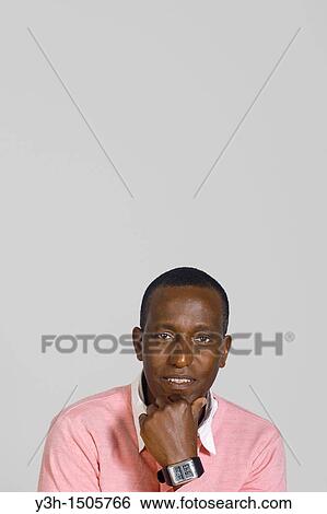 Stock Photograph - Studio shot of cuban man, looking at camera. Fotosearch