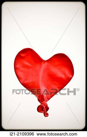 Studio Shot of deflated red balloon. View Large Photo Image Stock Photograph - Studio Shot of deflated red balloon.. Fotosearch