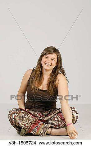 Studio shot of female teenager, smiling View Large Photo Image Picture - Studio shot of female teenager, smiling. Fotosearch