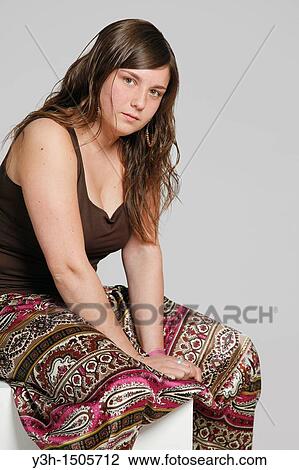 Stock Image - Studio shot of female teenager. Fotosearch