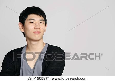 Picture - Studio shot of Korean man. Fotosearch