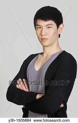Studio shot of Korean man View Large Photo Image Picture - Studio shot of Korean man. Fotosearch